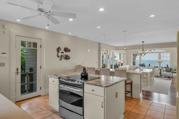 a kitchen with a stove a refrigerator and a sink