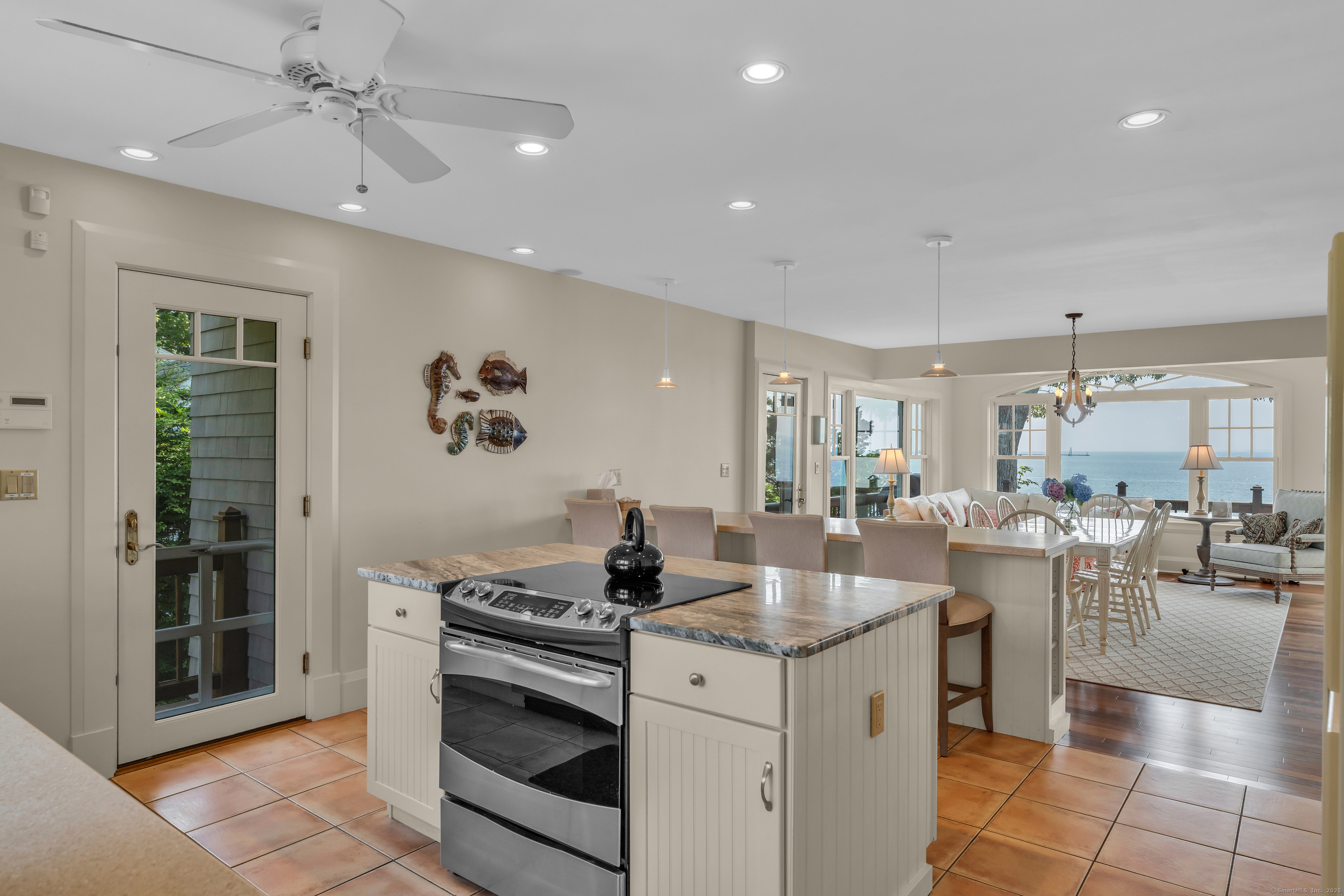 55 Shore Road Clinton, CT 06413 - Photo 13 of 33 a kitchen with a stove a refrigerator and a sink