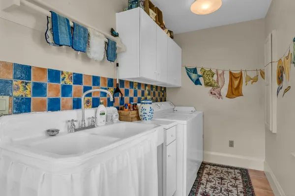 a bathroom with a sink and a shower curtain