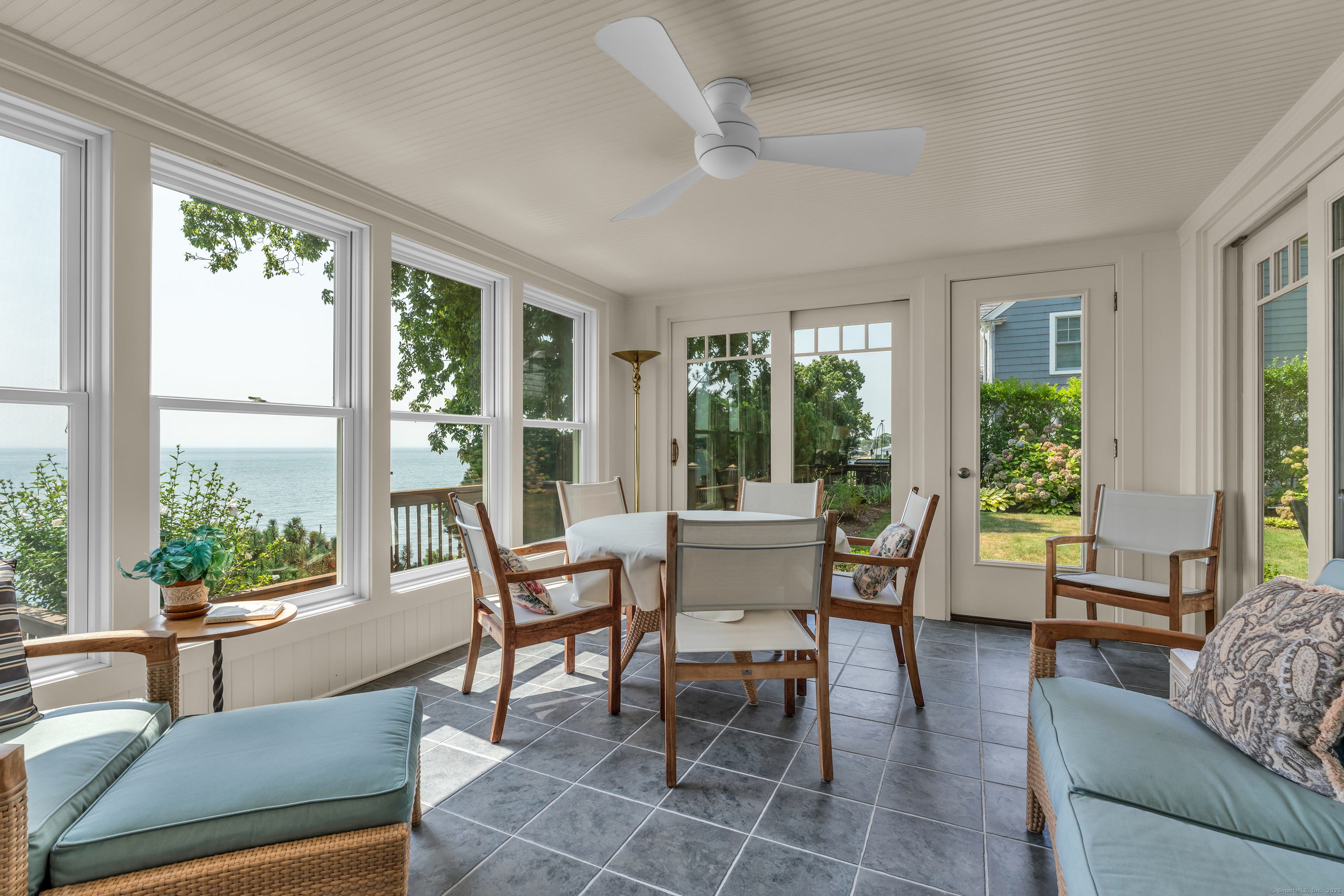 55 Shore Road Clinton, CT 06413 - Photo 16 of 33 a dining room with furniture a livingroom and outdoor view