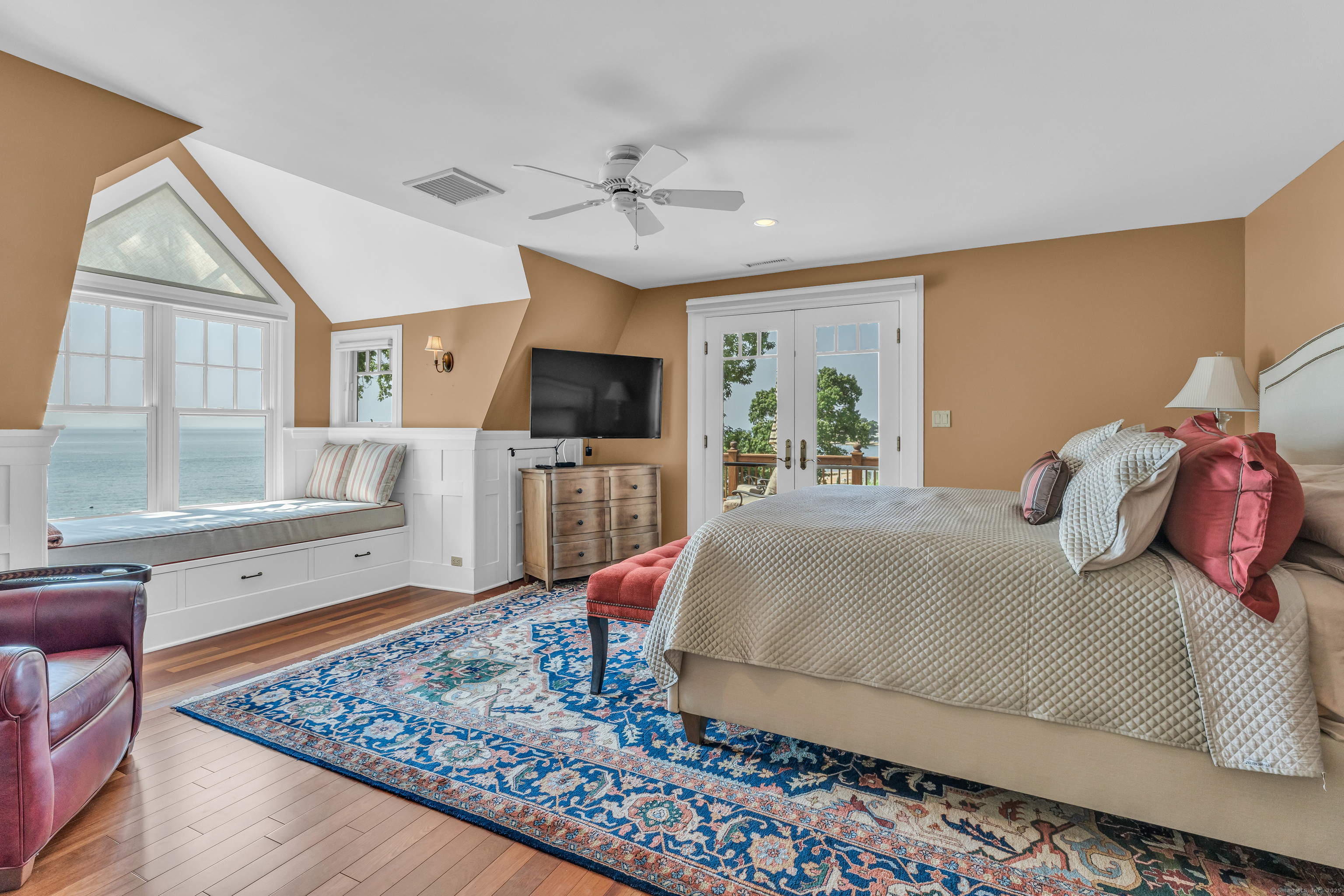 55 Shore Road Clinton, CT 06413 - Photo 17 of 33 a bed room with a bed television and a window