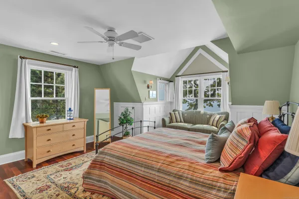 a bedroom with a large bed and a window