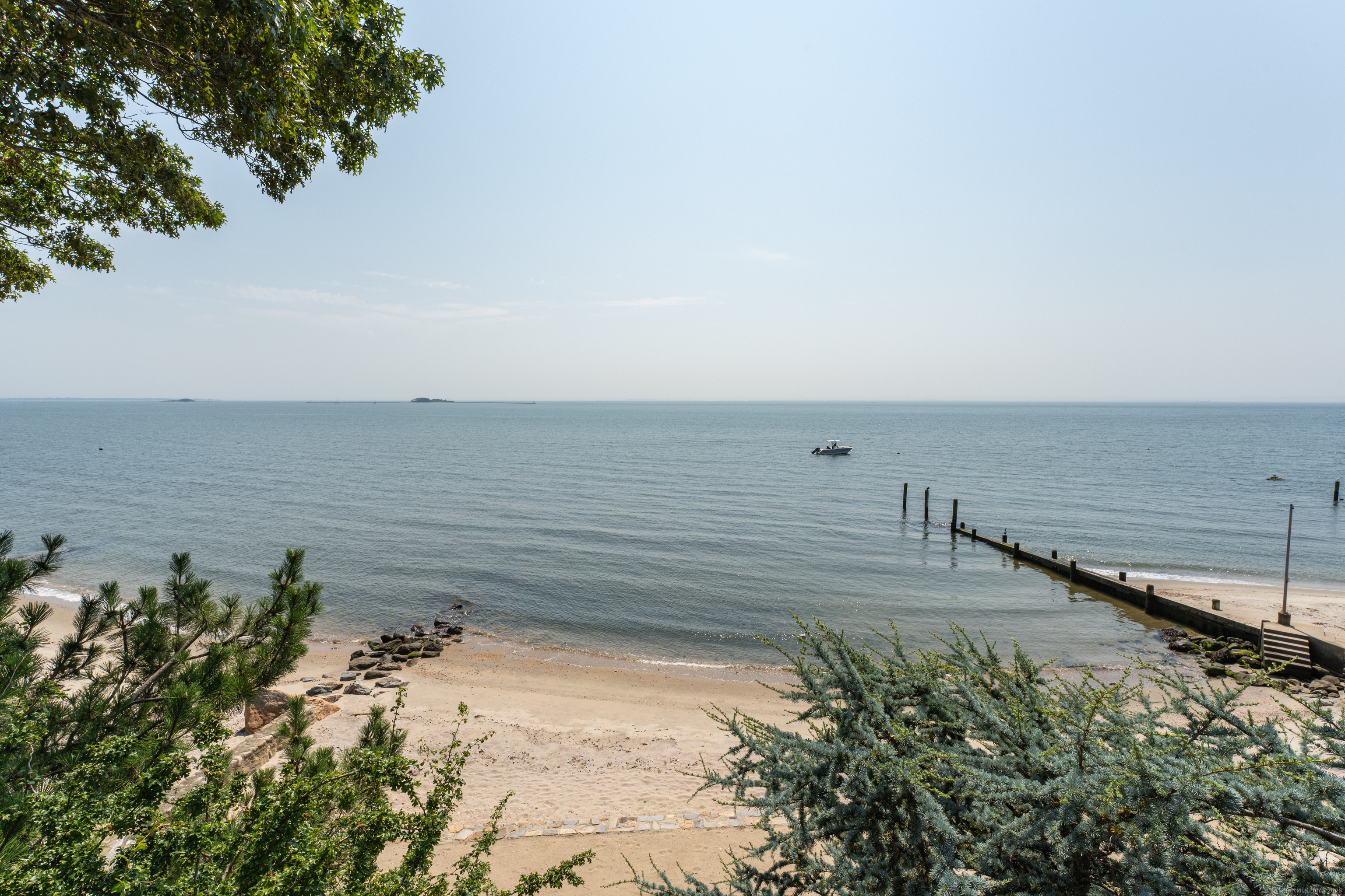 55 Shore Road Clinton, CT 06413 - Photo 2 of 33 a view of an ocean beach