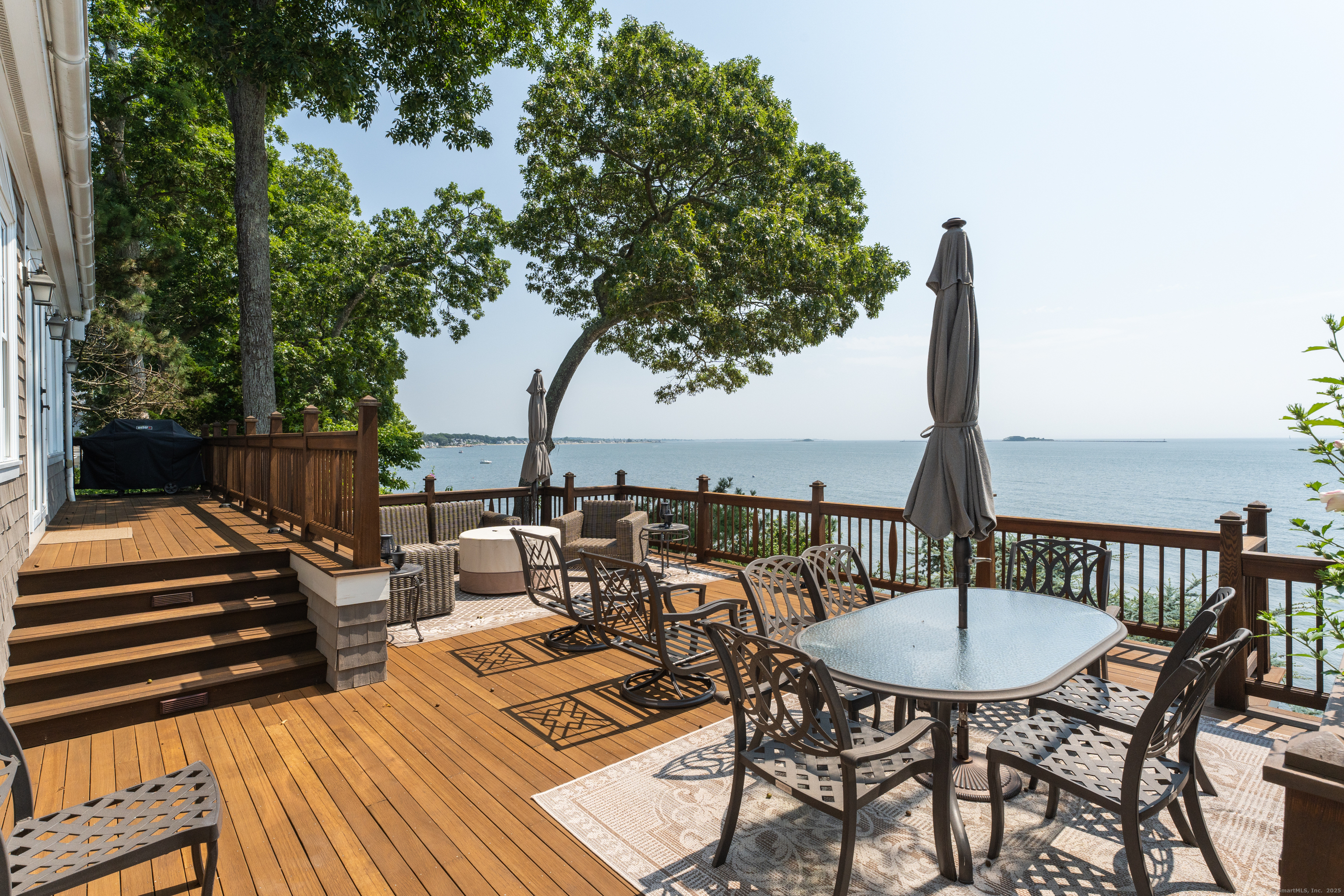 55 Shore Road Clinton, CT 06413 - Photo 28 of 33 a view of a chairs and table on the roof deck