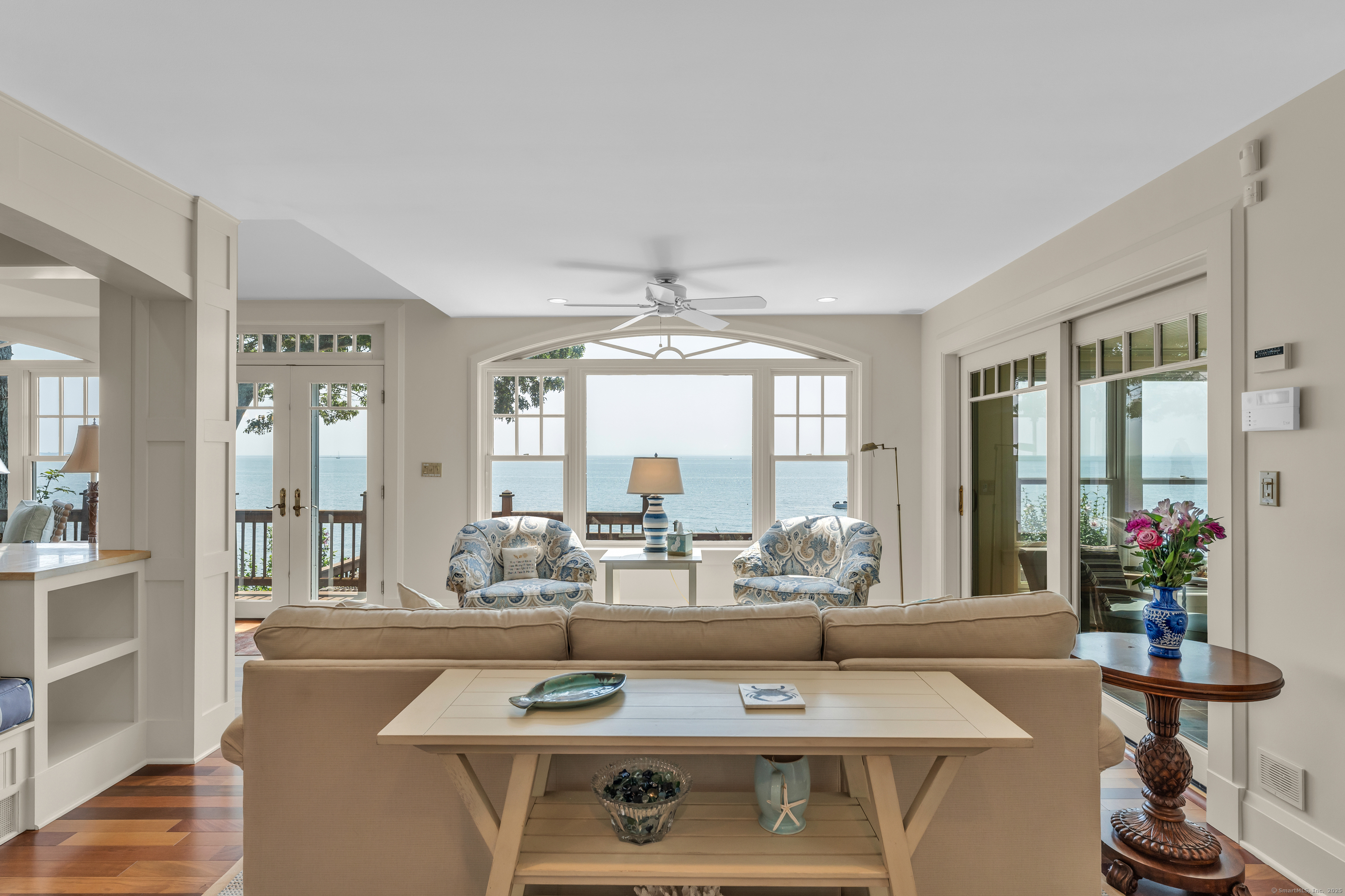 55 Shore Road Clinton, CT 06413 - Photo 5 of 33 a living room with furniture and a large window