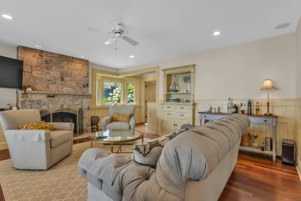 a living room with furniture and a fireplace