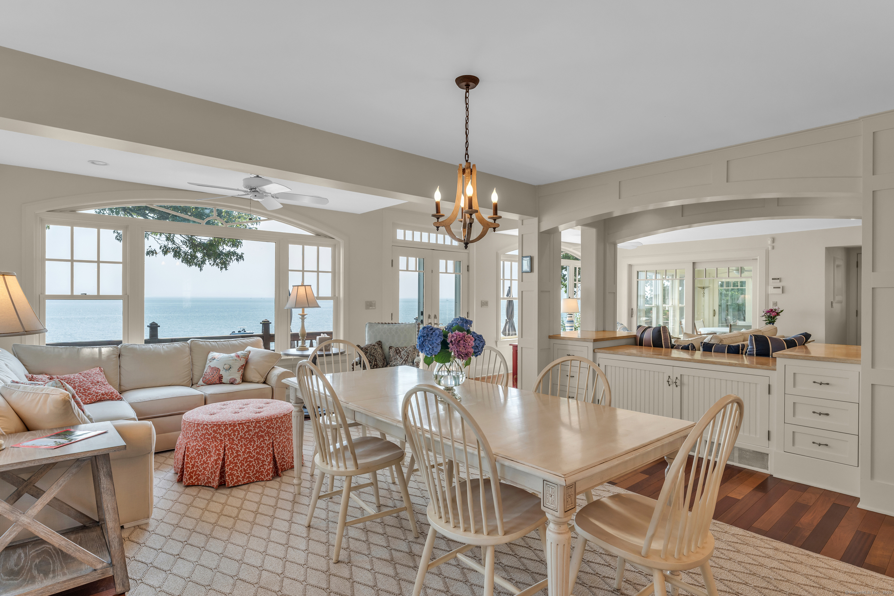 55 Shore Road Clinton, CT 06413 - Photo 9 of 33 a dining room with furniture a chandelier and wooden floor