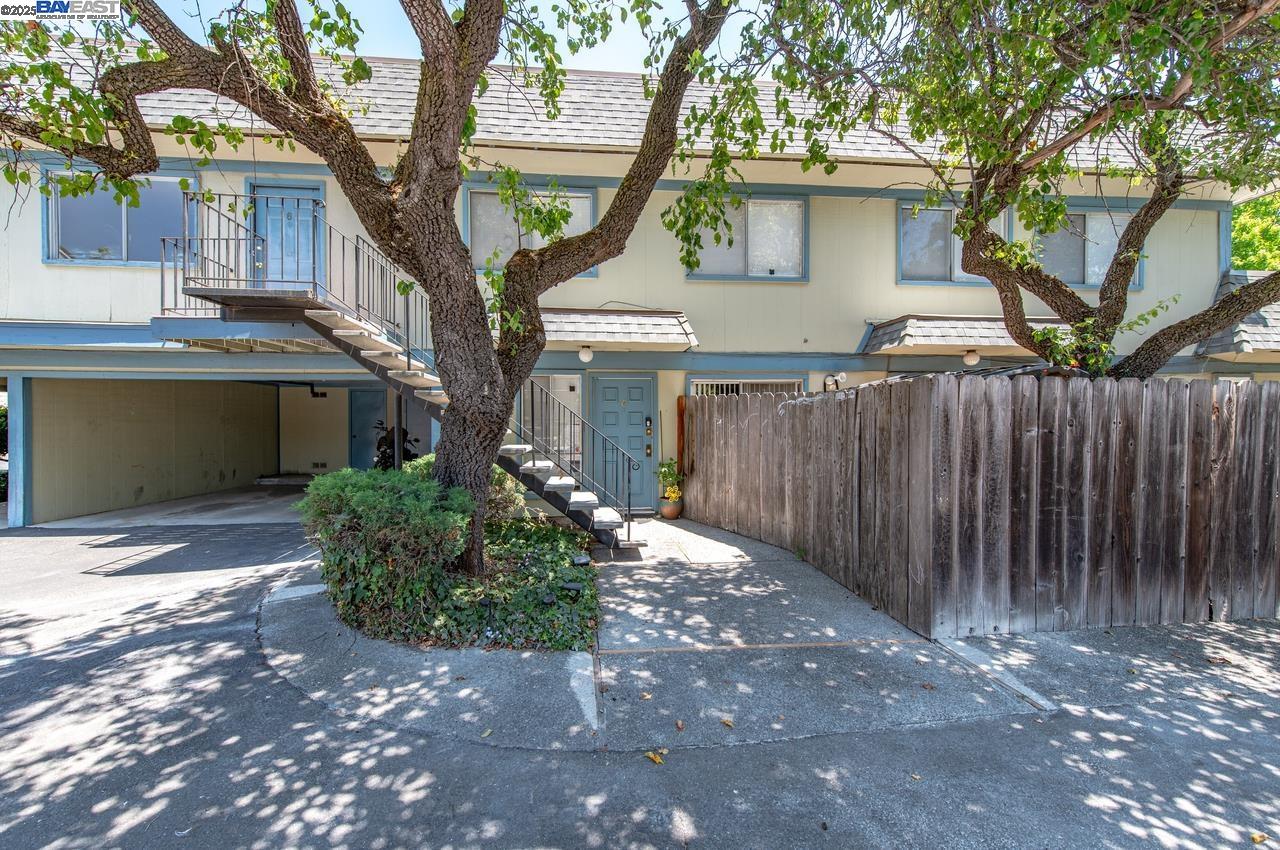 4327 Fairlands Drive Pleasanton, CA 94588 - Photo 8 of 16 a front view of a house with a garden and trees