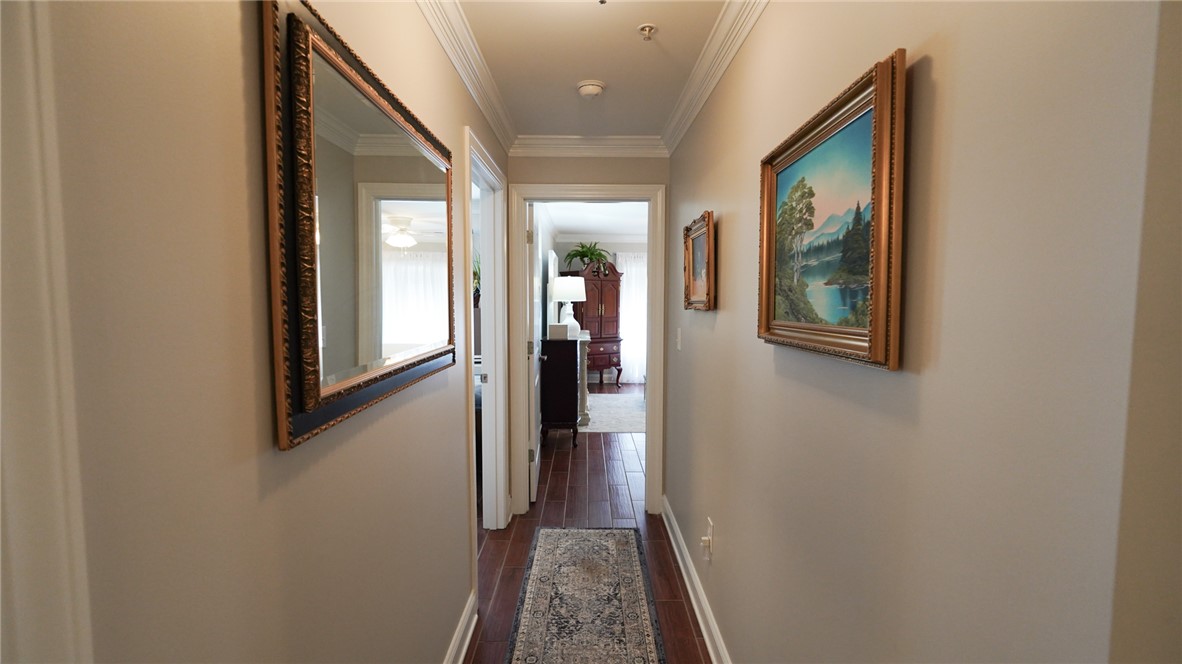 303 Lookover Drive Anderson, SC 29621 - Photo 25 of 46 This inviting hallway features rich hardwood flooring and elegant crown molding.