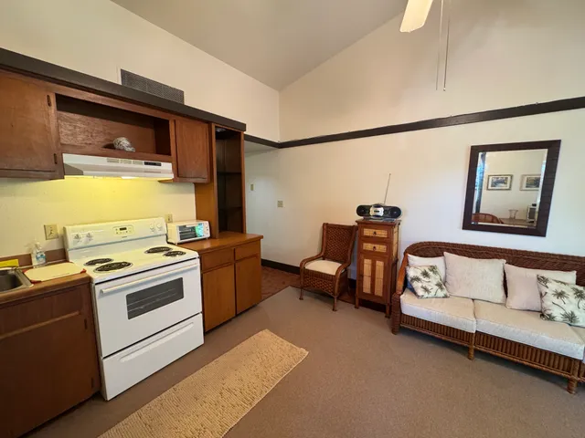 a kitchen with a stove and a refrigerator