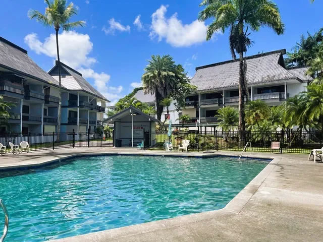 a view of a house with swimming pool and porch with furniture