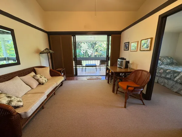 a bedroom with furniture and a window