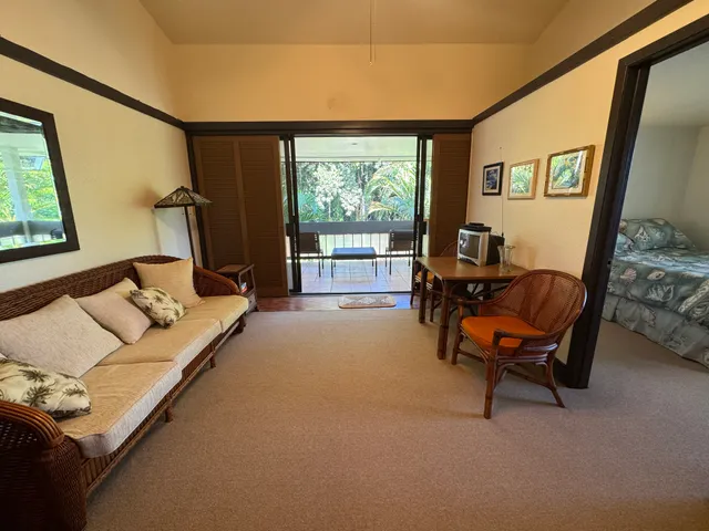 a bedroom with furniture and a window