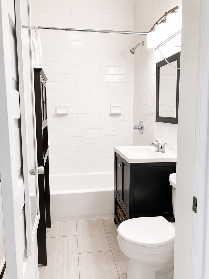 3749 North Seminary Avenue, Unit 1 Chicago, IL 60613 - Photo 14 of 25 a bathroom with a sink toilet and shower