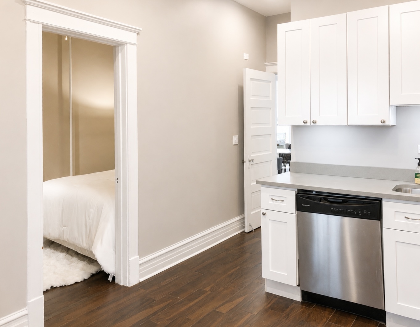 3749 North Seminary Avenue, Unit 1 Chicago, IL 60613 - Photo 15 of 25 a kitchen with granite countertop white cabinets and white appliances