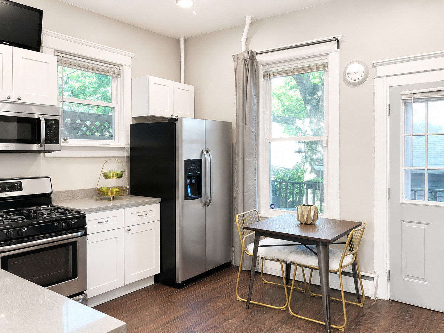 3749 North Seminary Avenue, Unit 1 Chicago, IL 60613 - Photo 9 of 25 a kitchen with a stove a refrigerator and wooden floor
