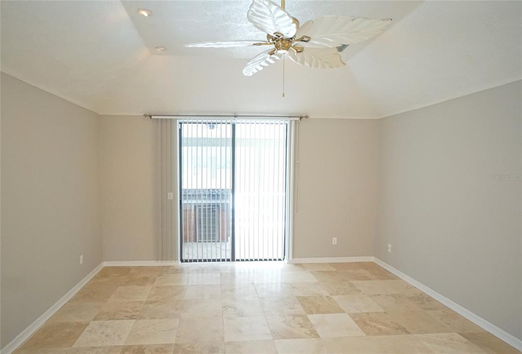 3807 Turkey Oak Drive Valrico, FL 33596 - Photo 13 of 44 an empty room with windows and ceiling fan