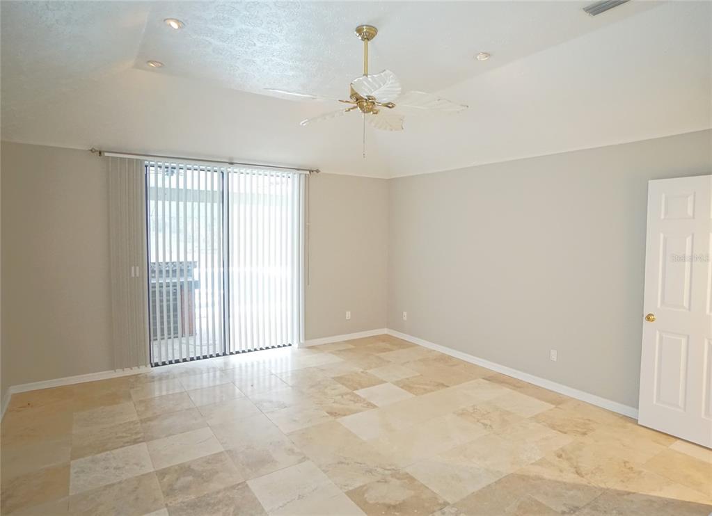 3807 Turkey Oak Drive Valrico, FL 33596 - Photo 19 of 44 an empty room with a ceiling fan and window