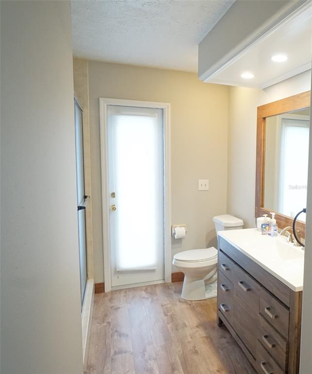 3807 Turkey Oak Drive Valrico, FL 33596 - Photo 35 of 44 a bathroom with a double vanity sink toilet mirror and bathtub