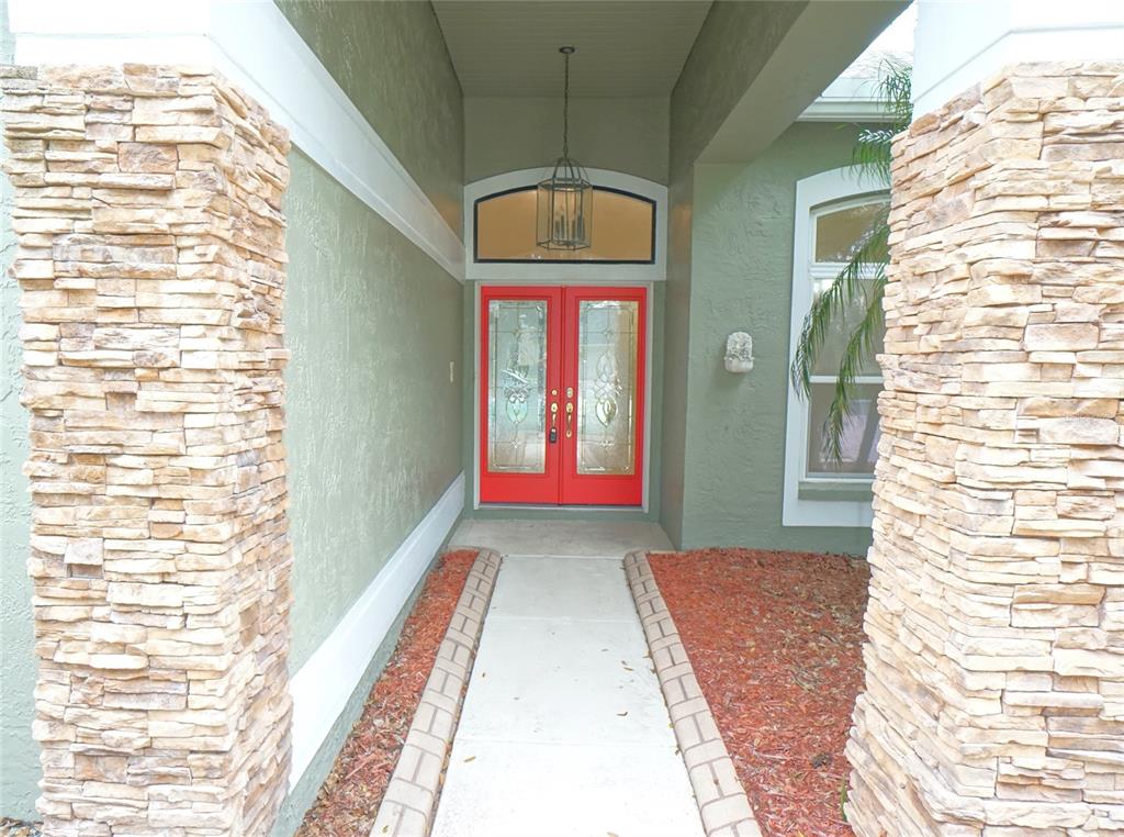3807 Turkey Oak Drive Valrico, FL 33596 - Photo 4 of 44 a view of a large room with wooden floor and windows