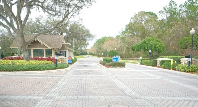 a view of a sign of a park next to a road