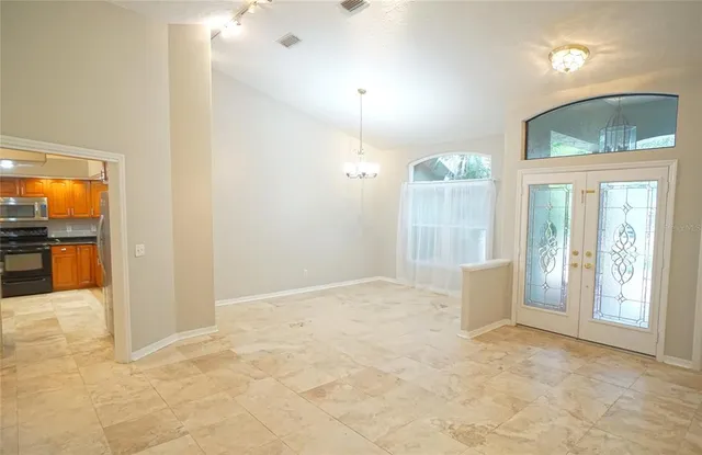 a view of an empty room and window