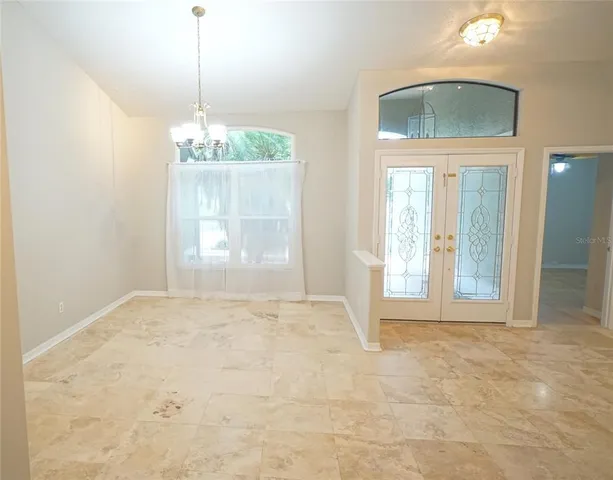 a view of an empty room and window