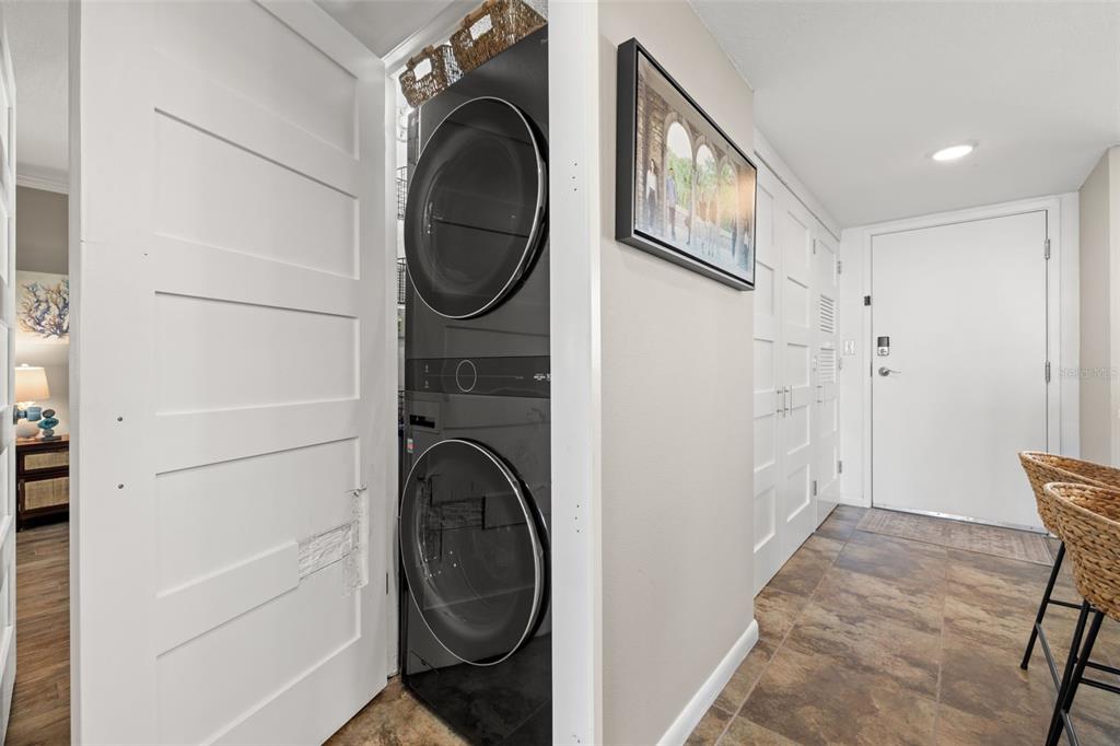 9525 Blind Pass Road, Unit 507 St. Pete Beach, FL 33706 - Photo 25 of 53 a utility room with dryer and washer