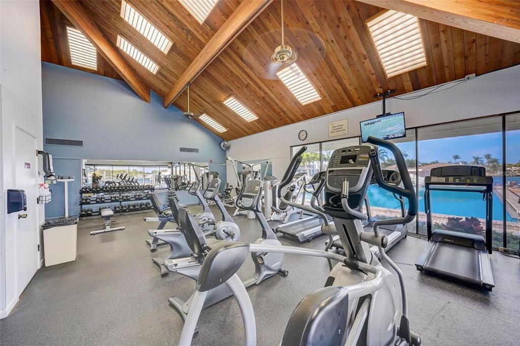 9525 Blind Pass Road, Unit 507 St. Pete Beach, FL 33706 - Photo 34 of 53 a view of a room with gym equipment