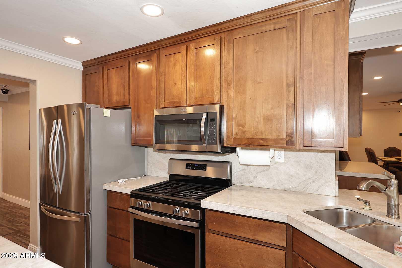 3502 North 22nd Street Phoenix, AZ 85016 - Photo 11 of 35 a kitchen with a refrigerator stove and sink