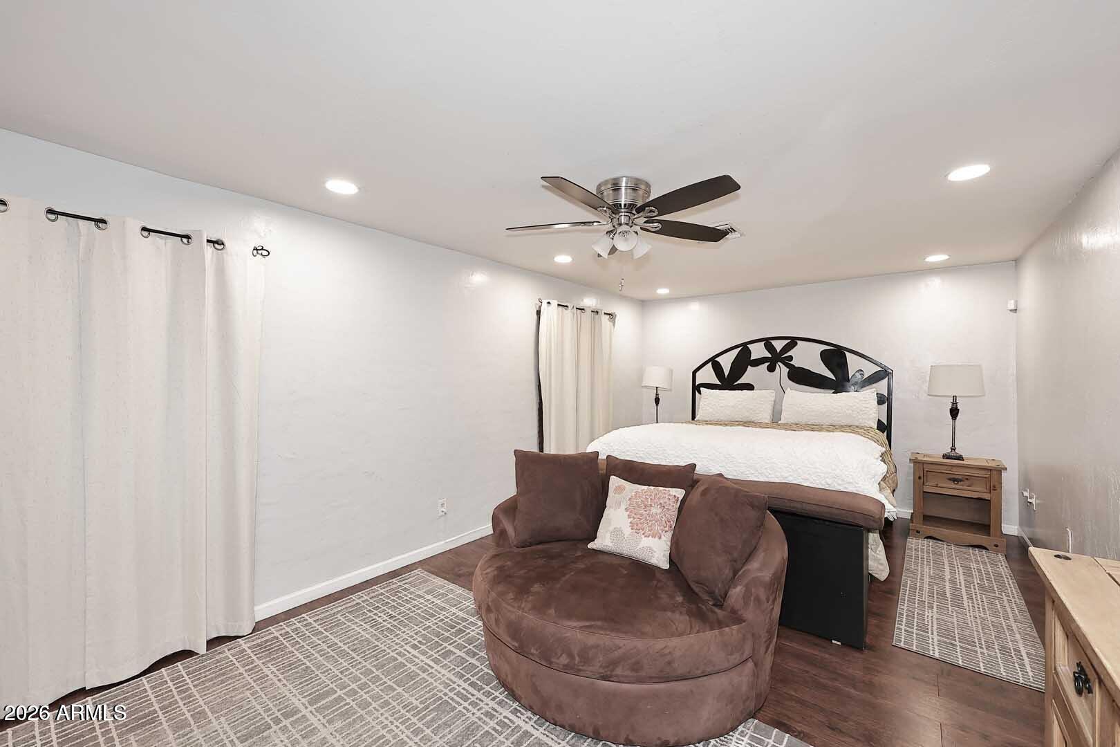 3502 North 22nd Street Phoenix, AZ 85016 - Photo 15 of 35 a bedroom with a bed and a chandelier