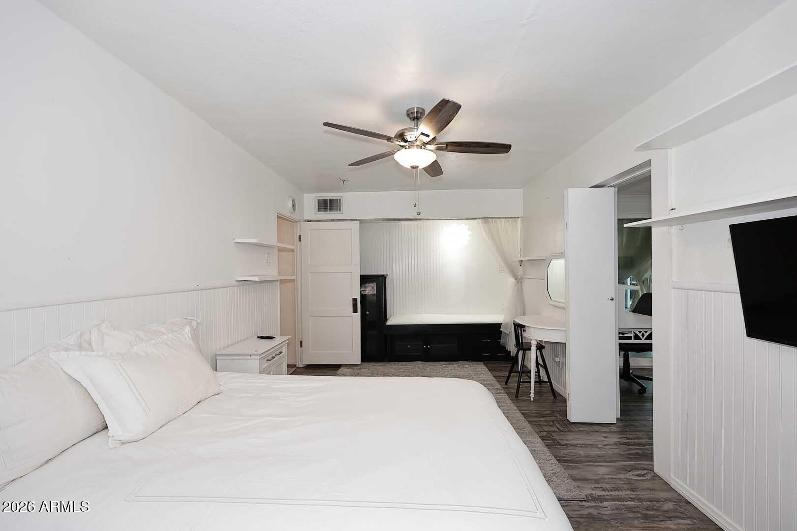 3502 North 22nd Street Phoenix, AZ 85016 - Photo 18 of 35 a large bedroom with a bed and a chandelier