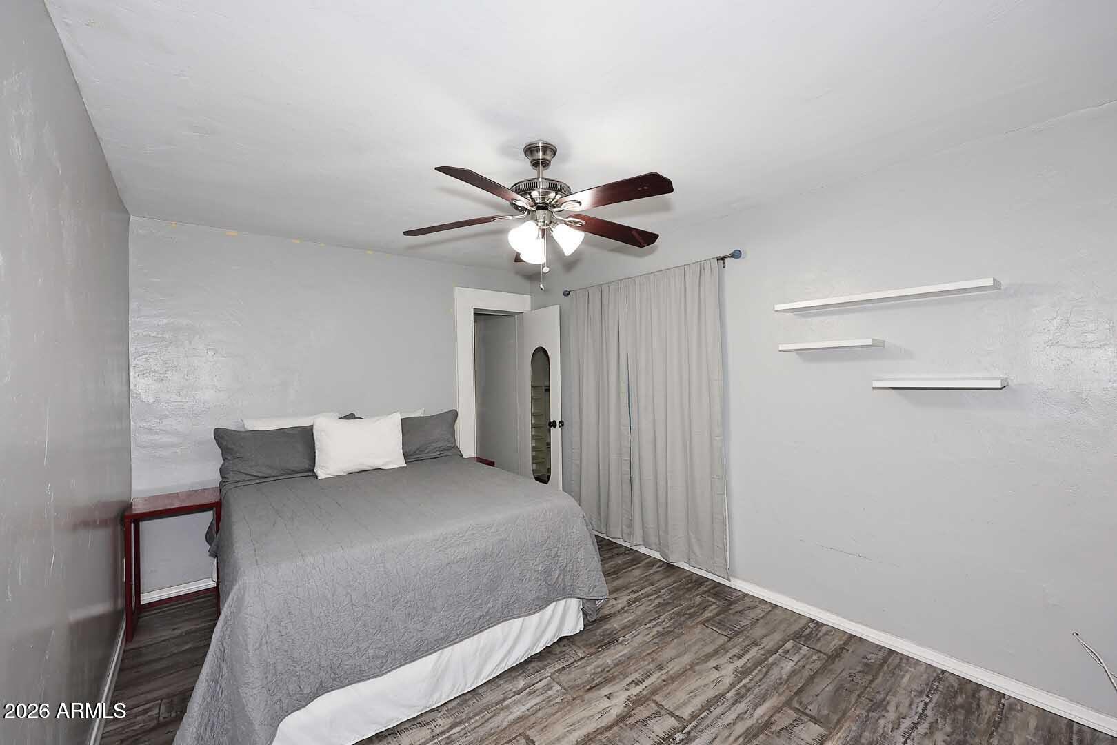 3502 North 22nd Street Phoenix, AZ 85016 - Photo 23 of 35 a bedroom with a bed and a ceiling fan
