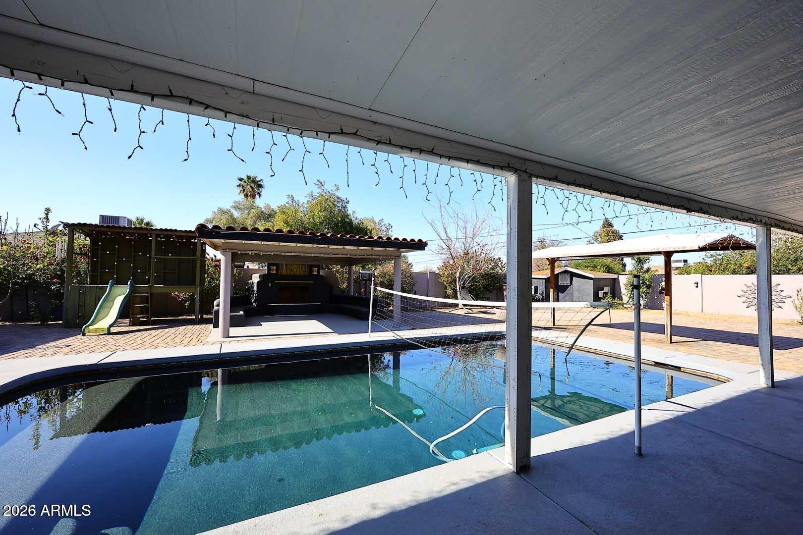 3502 North 22nd Street Phoenix, AZ 85016 - Photo 28 of 35 a view of a swimming pool with a patio