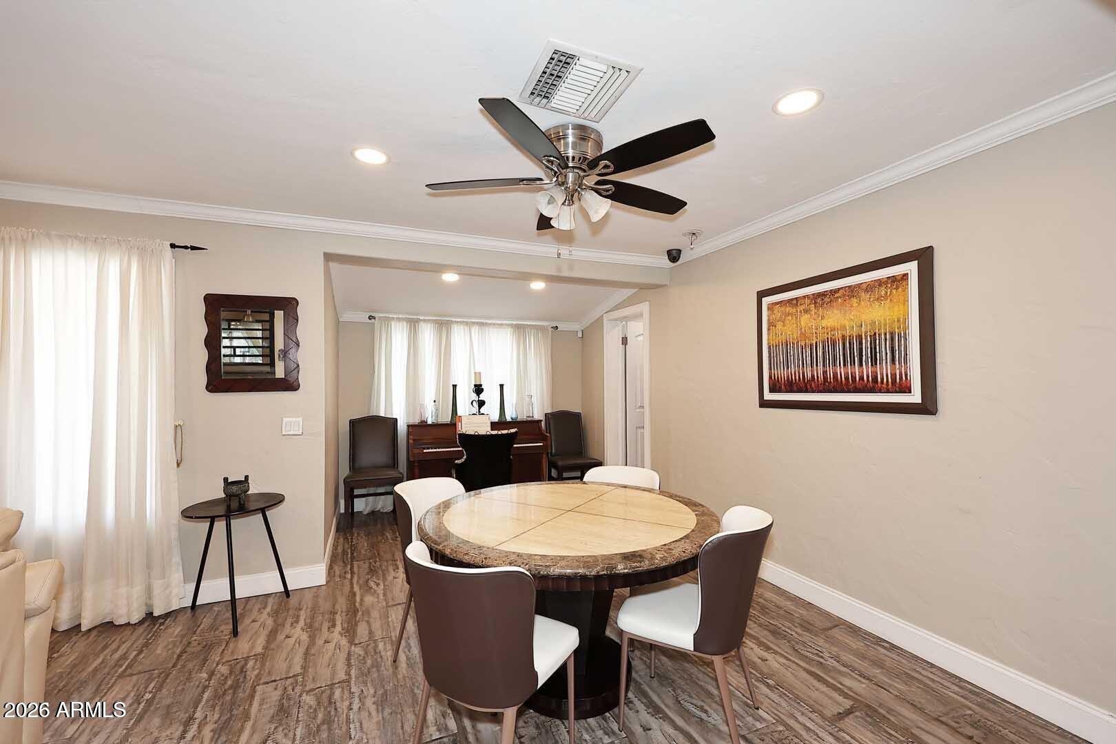 3502 North 22nd Street Phoenix, AZ 85016 - Photo 7 of 35 a view of a dining room with furniture window and wooden floor