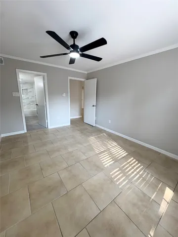 a view of a livingroom with an empty space and a window