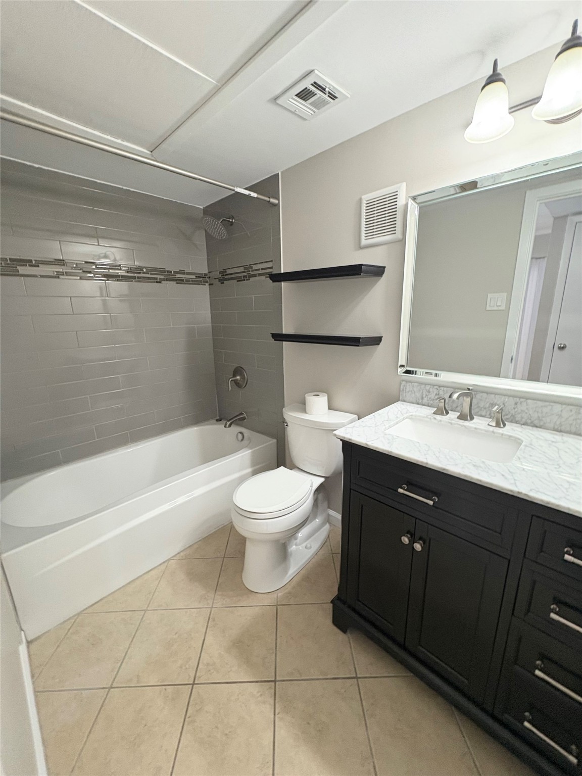 2800 Jeanetta Street, Unit 408 Houston, TX 77063 - Photo 9 of 14 a bathroom with a sink a toilet and shower