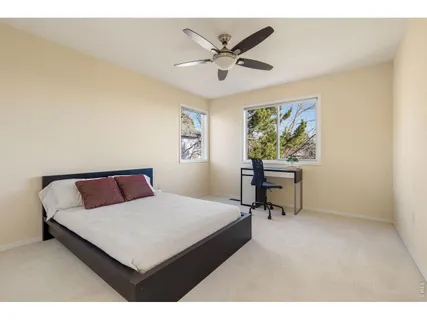 a bedroom with a bed and a table