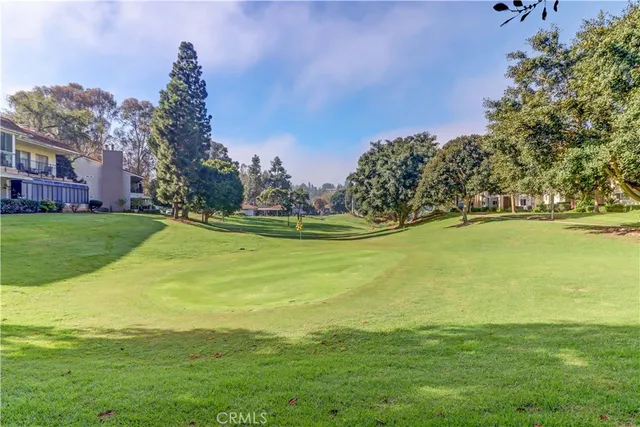 a view of a large building with garden in front of it