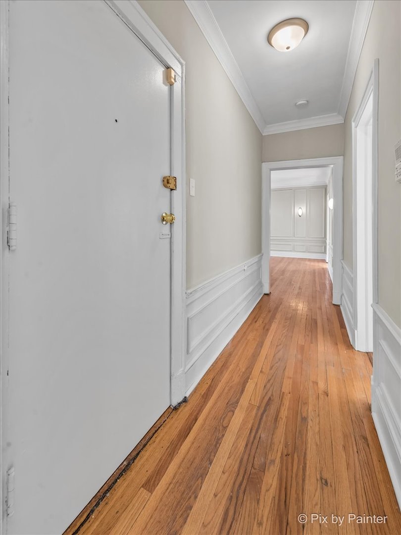 835 East 49th Street, Unit 3 Chicago, IL 60615 - Photo 11 of 16 a view of hallway with wooden floor