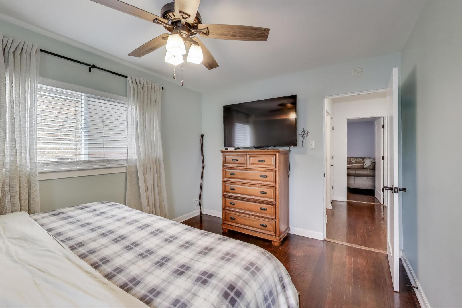 3816 Wisconsin Avenue Berwyn, IL 60402 - Photo 12 of 32 a bedroom with a bed and a flat screen tv