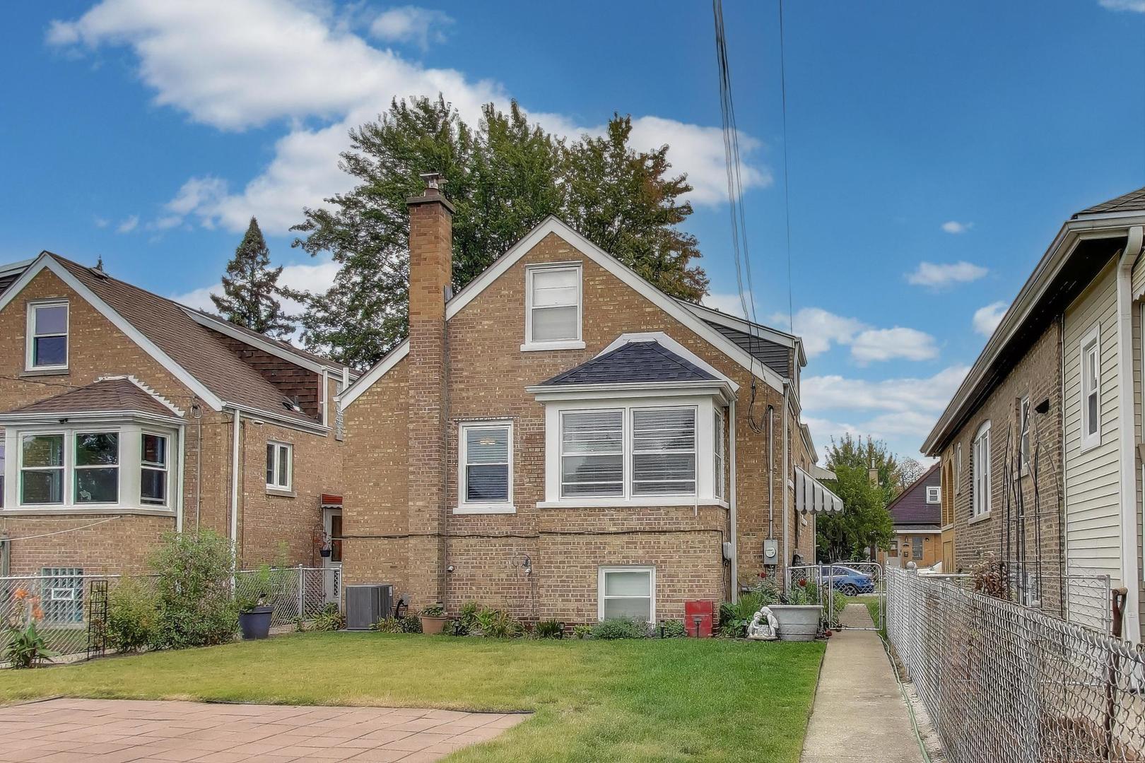 3816 Wisconsin Avenue Berwyn, IL 60402 - Photo 20 of 32 a front view of a house with a garden