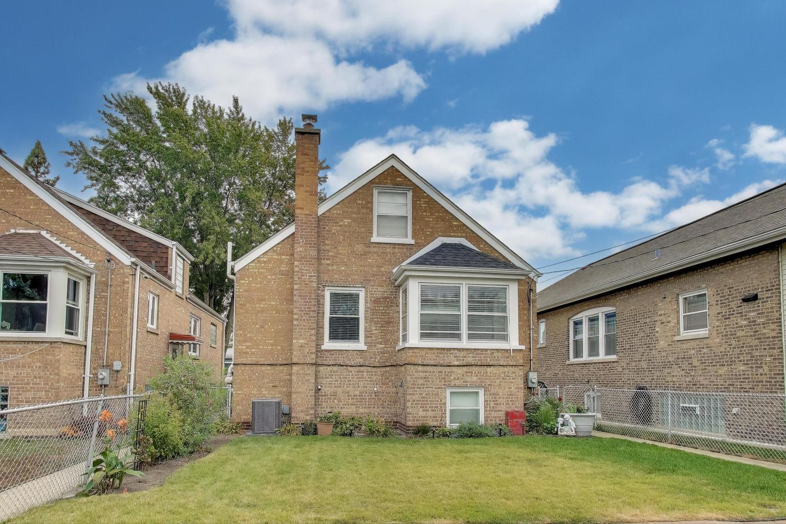 3816 Wisconsin Avenue Berwyn, IL 60402 - Photo 21 of 32 a front view of a house with a garden