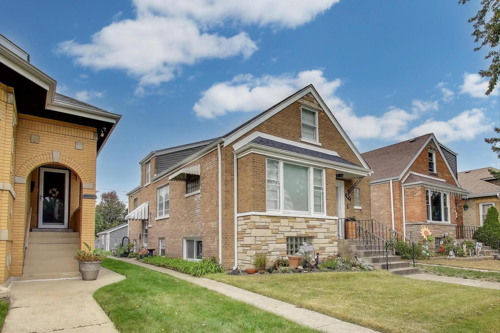 3816 Wisconsin Avenue Berwyn, IL 60402 - Photo 3 of 32 a front view of a house with garden