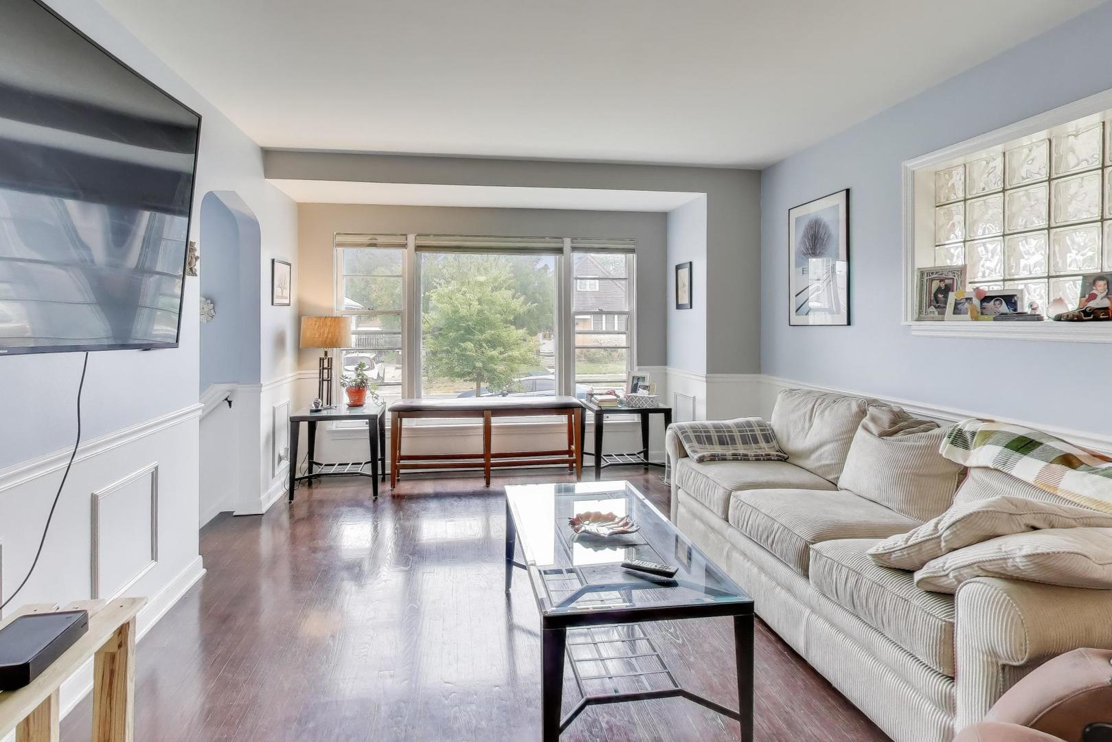 3816 Wisconsin Avenue Berwyn, IL 60402 - Photo 6 of 32 a living room with furniture and a large window