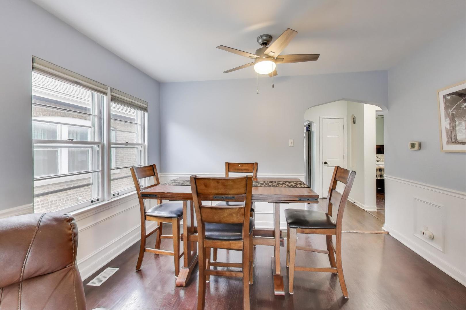 3816 Wisconsin Avenue Berwyn, IL 60402 - Photo 7 of 32 a view of a dining room with furniture and wooden floor