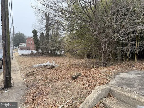 a view of a street with a building