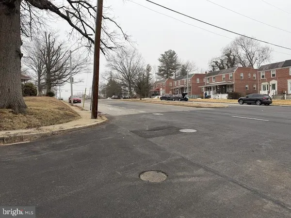 a view of street with parked cars