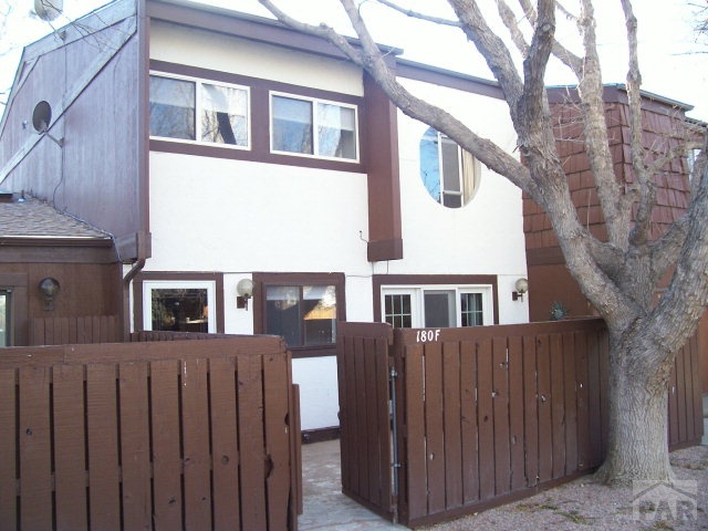 a front view of a house with a fence