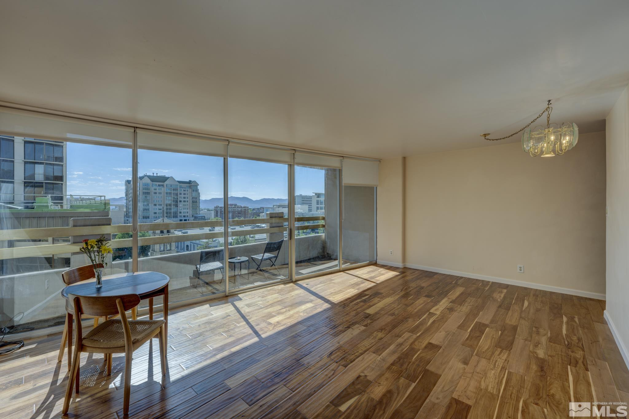100 North Arlington Avenue, Unit 6B Reno, NV 89501 - Photo 2 of 23 a living room with a large window and furniture
